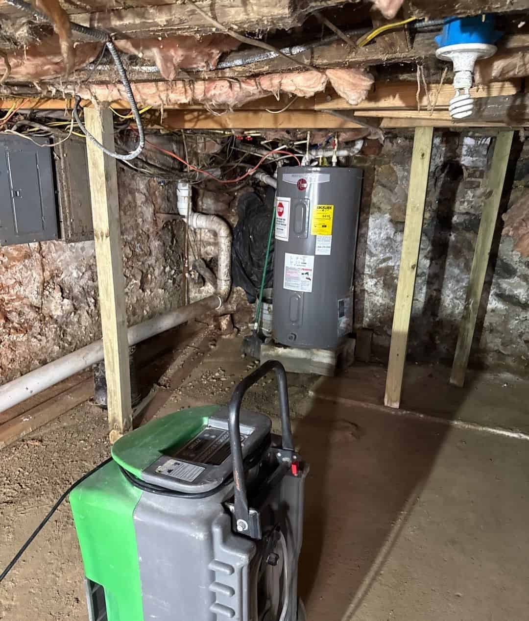 Commercial dehumidifier drying the basement after the flood water was pumped out