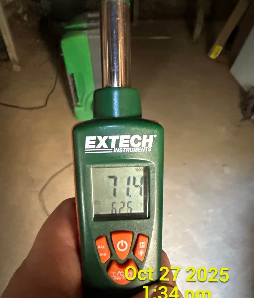 Moisture meter reading with date and time stamp documenting structural drying progress for the insurance claim